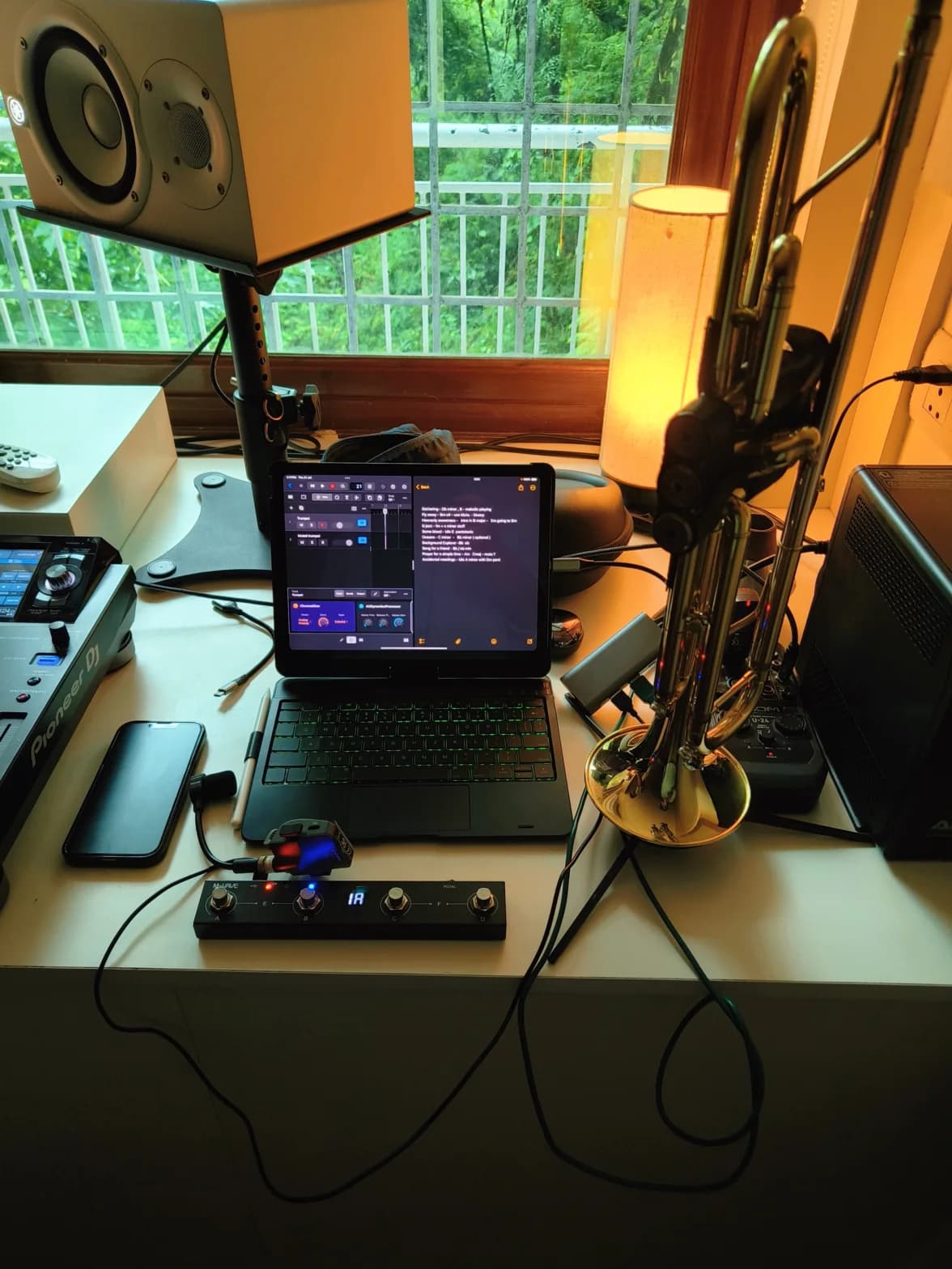 Early iPad-based live effects rig with foot controller and trumpet